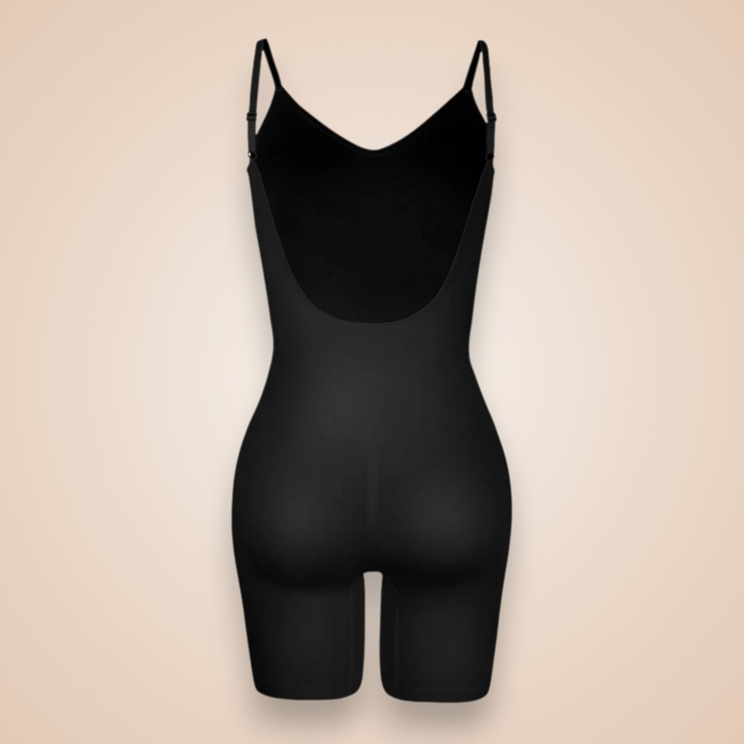 Combinaison gainante noire femme vue dos, lingerie sculptante à bretelles fines, effet push-up fessier et maintien intégral de la silhouette.