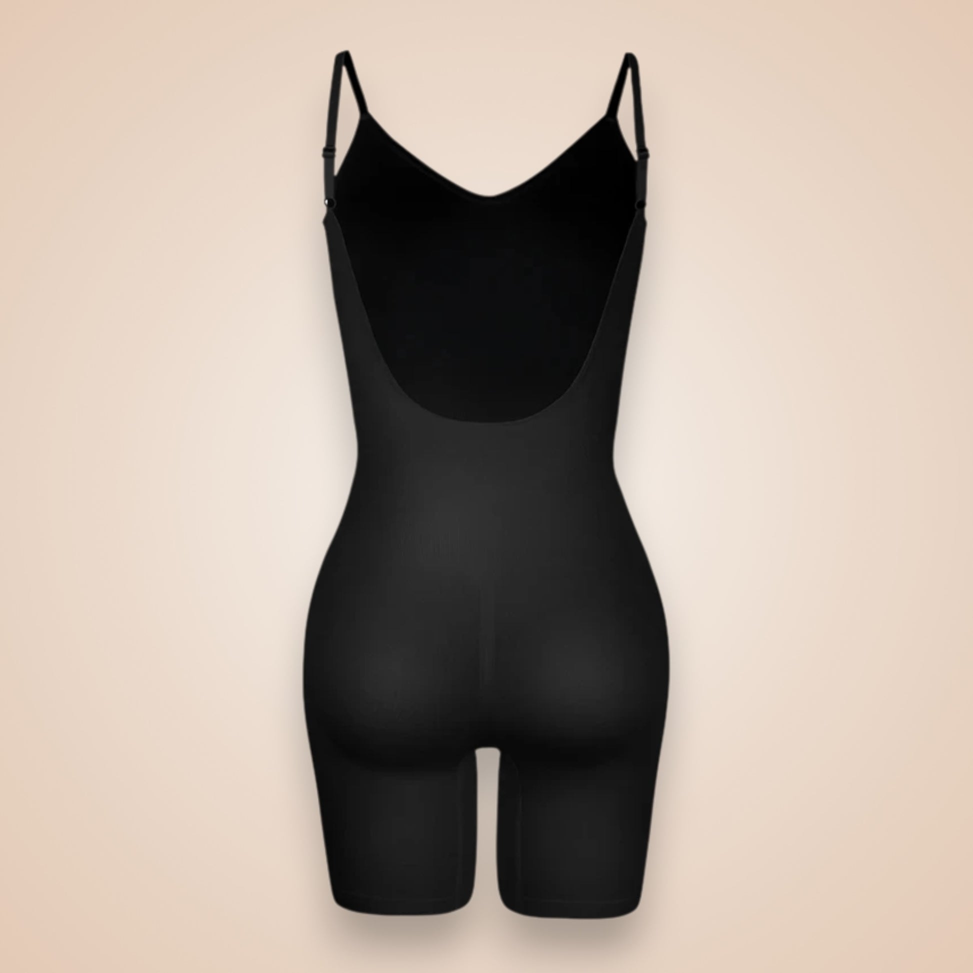 Combinaison gainante noire femme vue dos, lingerie sculptante à bretelles fines, effet push-up fessier et maintien intégral de la silhouette.