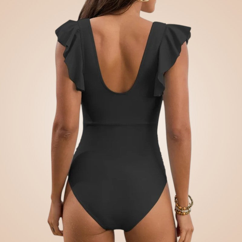 Maillot de bain amincissant noir Maât vue de dos avec dos échancré et manches volantées