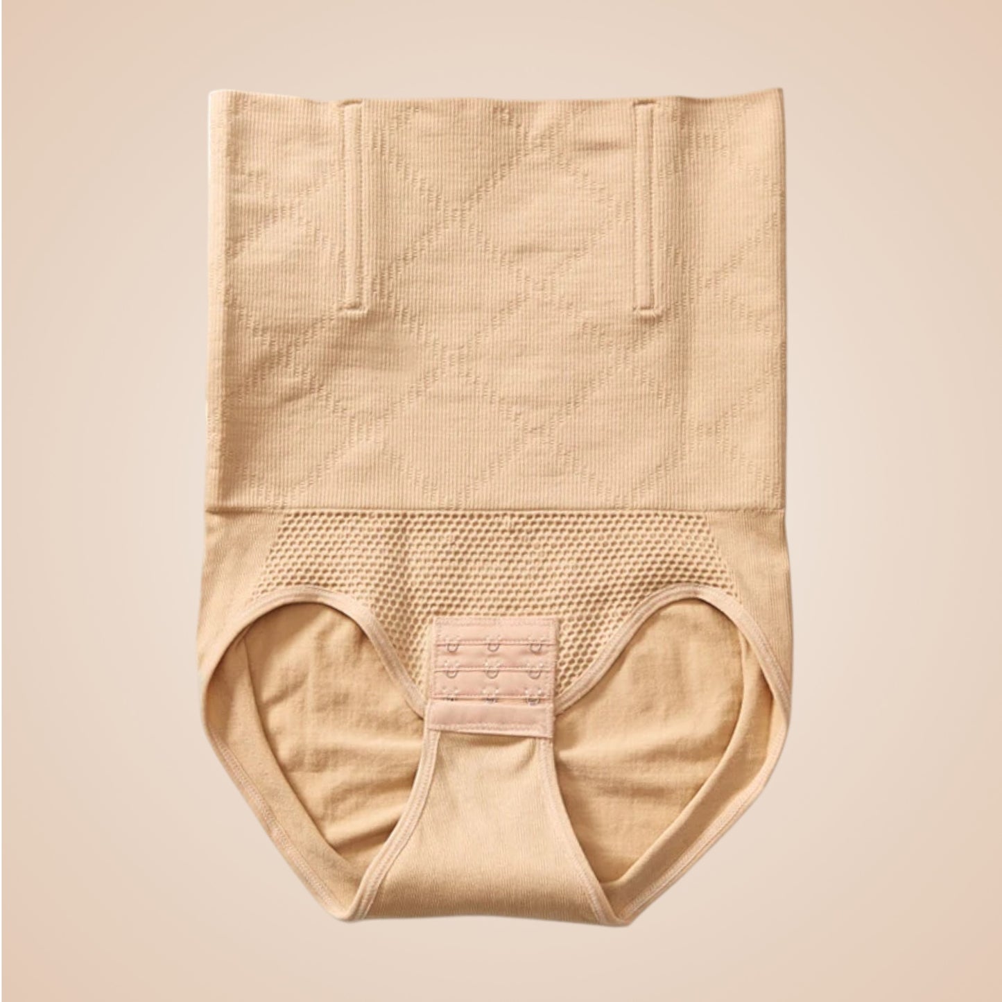 Culotte gainante beige taille haute avec zones en maille et fermeture à crochets devant.